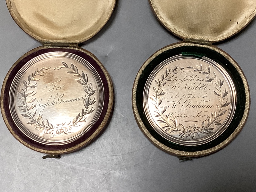 Two cased William IV silver medallions within graved inscriptions, maker JE Terry and Co, London 1832 and 1833, diameter 52 mm.